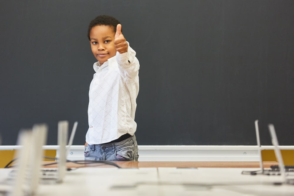 African,Boy,As,A,Student,In,Front,Of,An,Empty