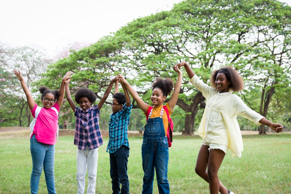 Group,Of,African,American,Children,Joining,Their,Hands,In,The