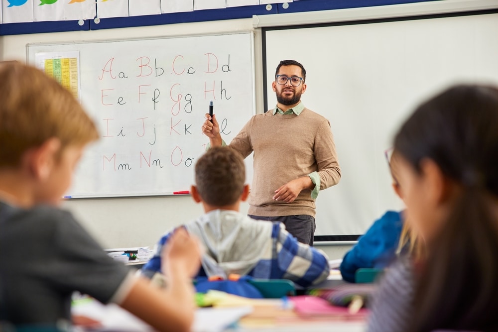 Smiling,Young,Male,Teacher,Helping,Students,Learn,English,Alphabets,In